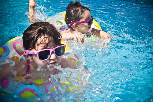 Photo of kids swimming in the pool